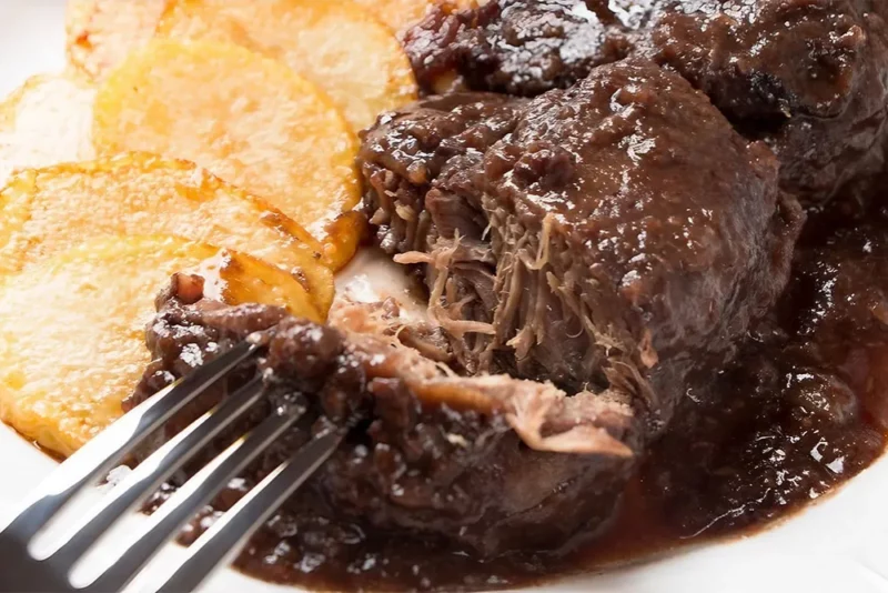 Traditional Seville food – pork cheeks cooked in wine