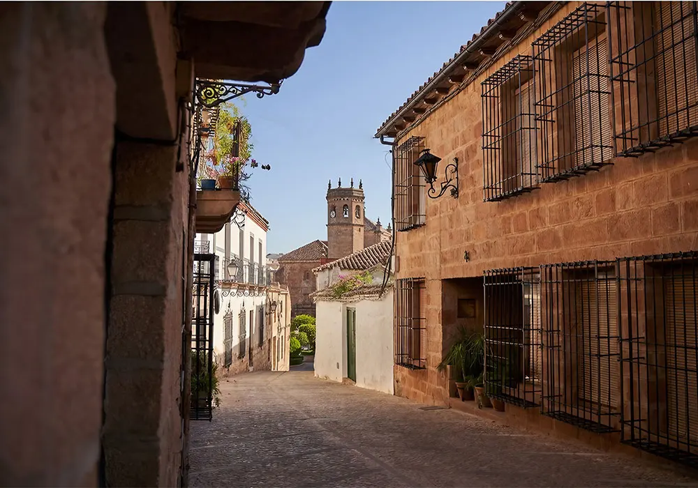 TOMA Spotlight: 8 Beautiful villages in Andalucia 8 Baños de la Encina: Street view of church in Baños de la Encina