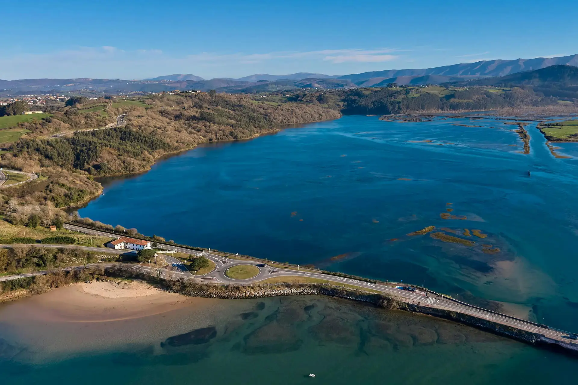 The Spain Road Trip 7 A stunning aerial shot of the Cantabria coastline, showcasing the meeting of sea and land - Photo by Mike Art 🎥 Visual Creator | Photography and Video 📸 from Pexels: https://www.pexels.com/photo/aerial-view-of-cantabria-s-coastal-landscape-36732264/