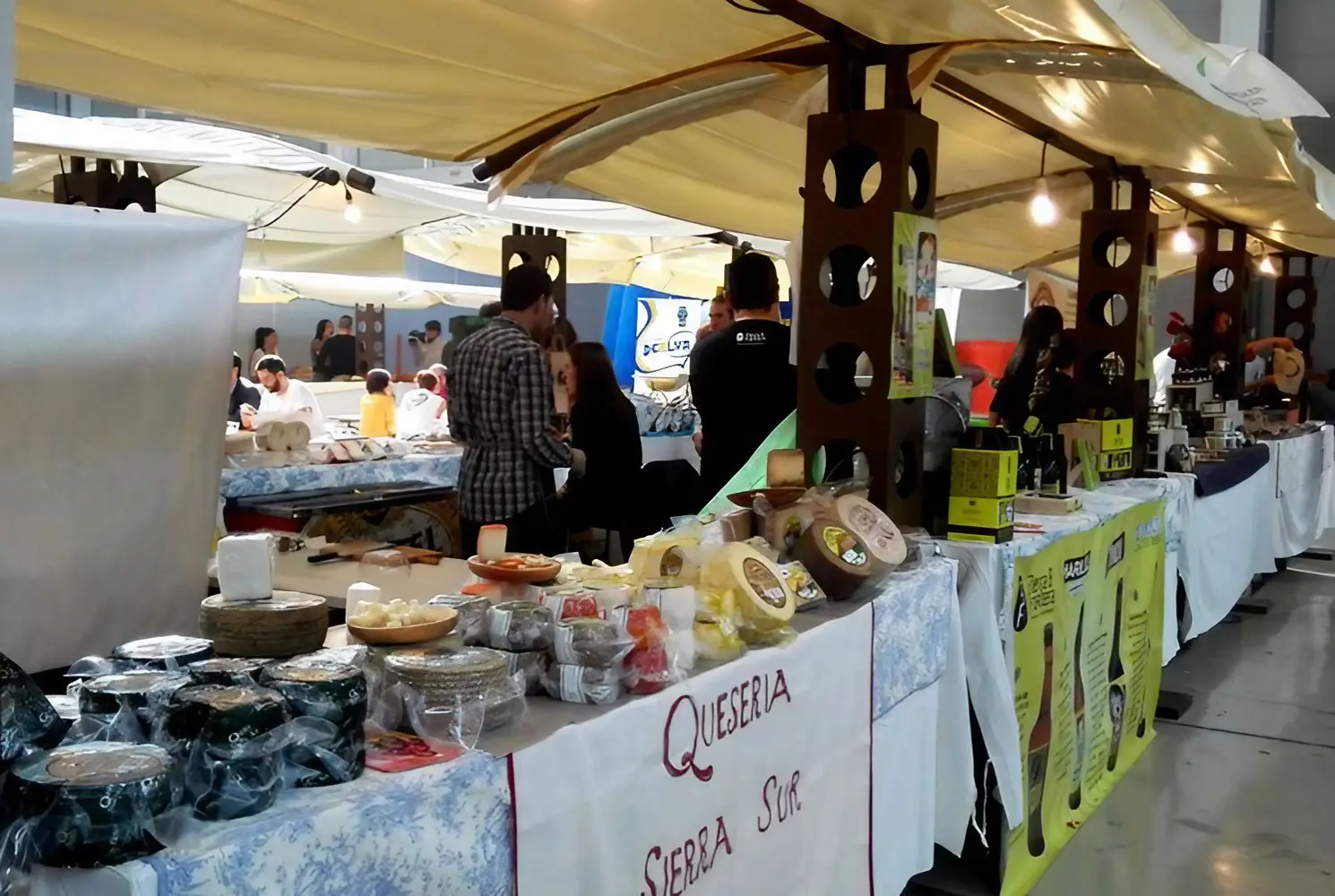 How to plan an Andalucía Itinerary 3 food market in Ubeda, Jaen showing stals selling different local cheeses