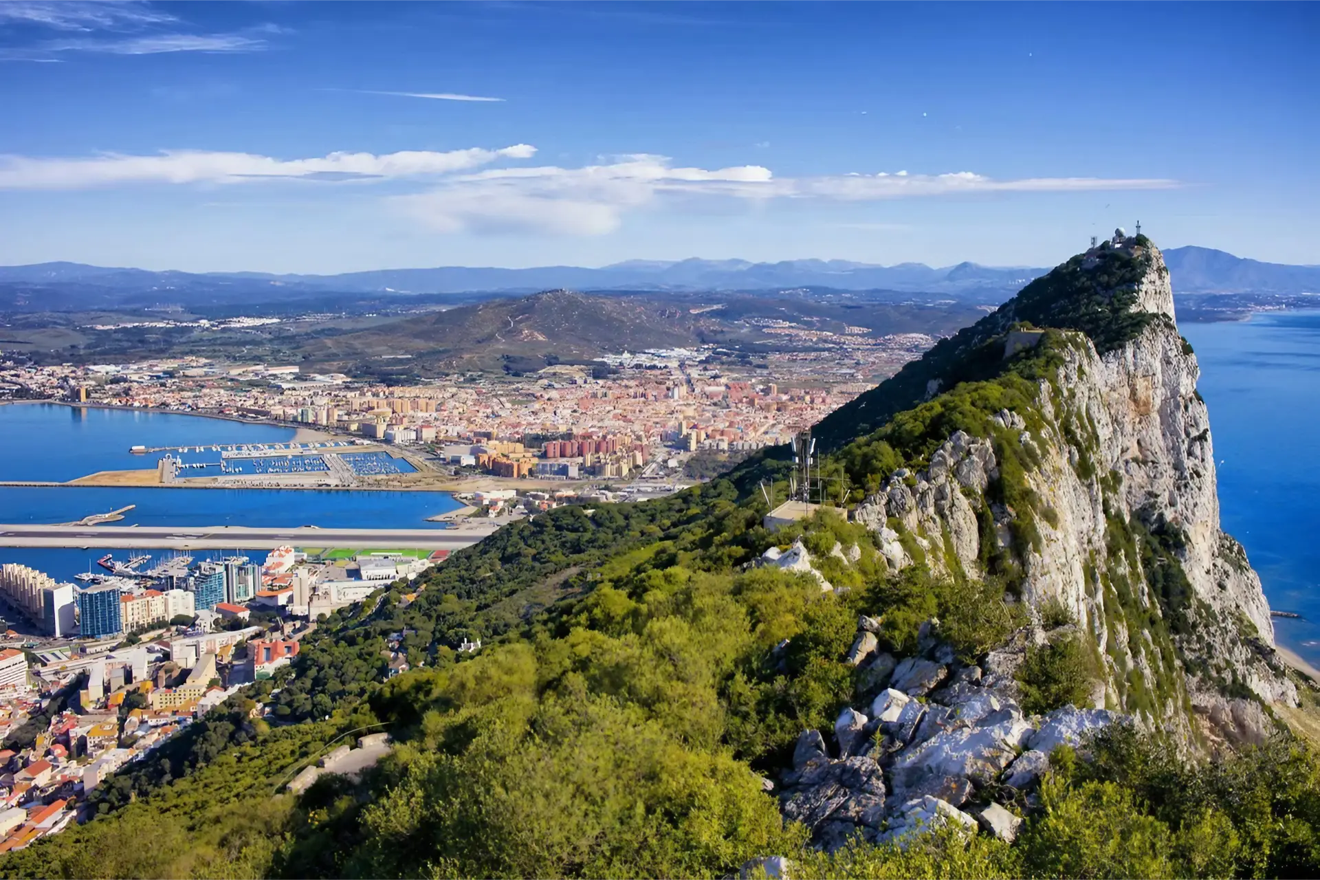 Gibraltar – view over the rock to the town and harbour. Image credit: Shutterstock