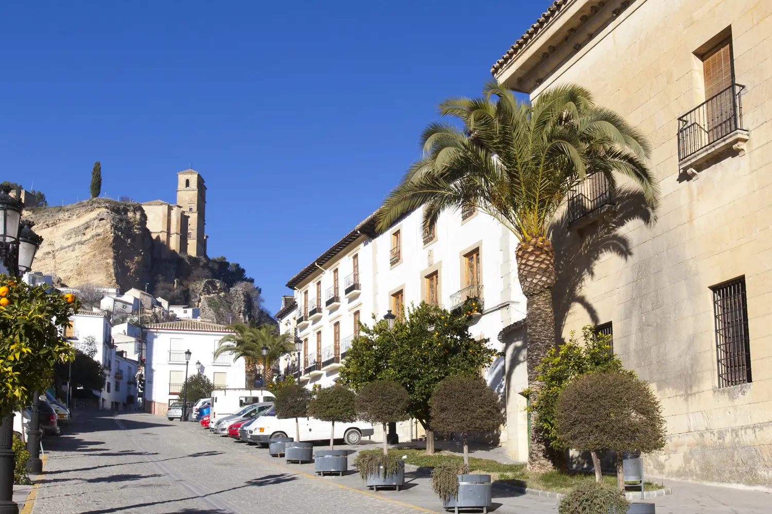 Spain in 2027: beyond the travel hotlists 2 the town of Montefrio with the castle rising in the background, in the Poniente Grandino area of Granada, Spain. - andalucia.org - © TURISMO ANDALUZ