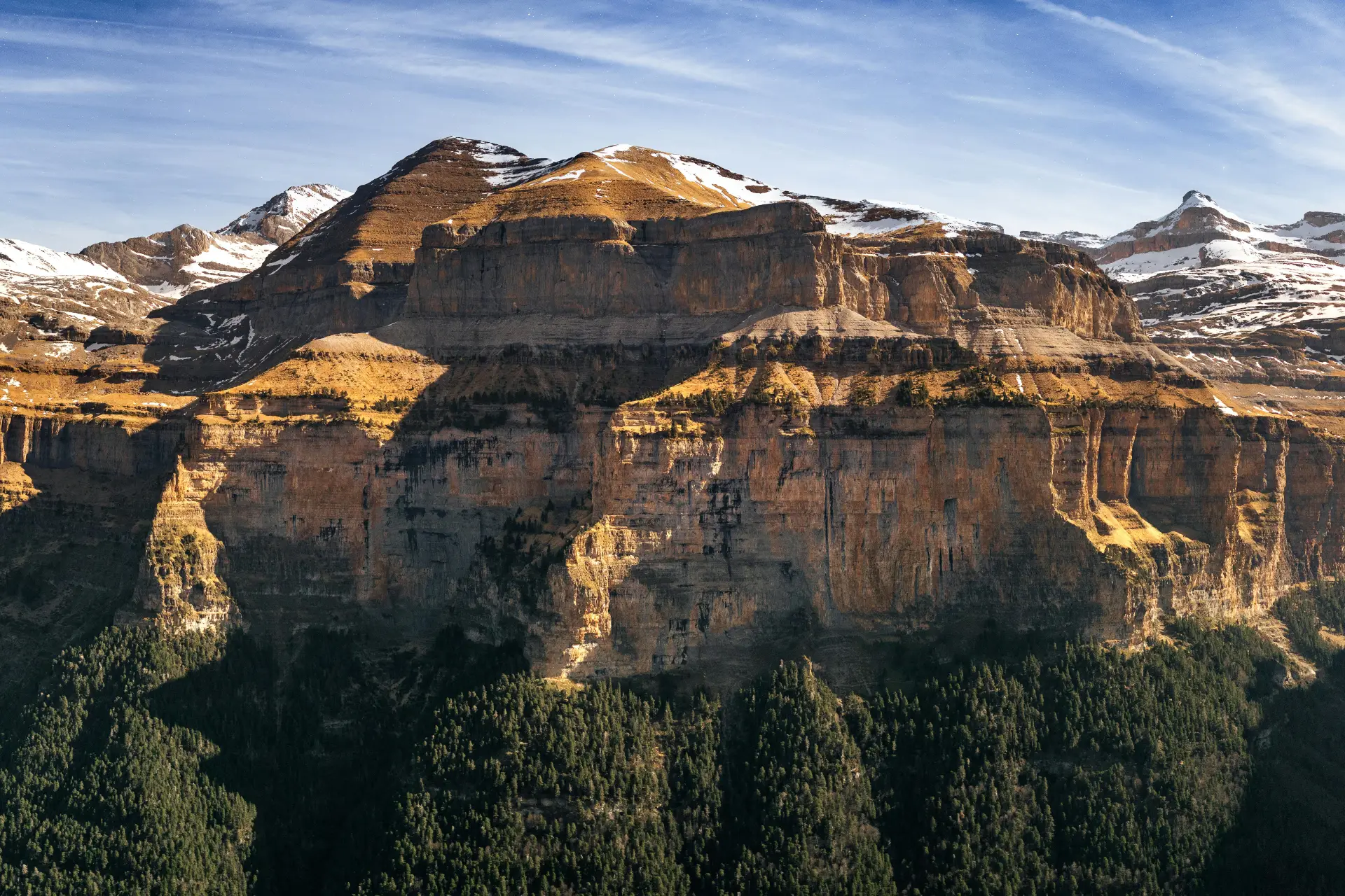 The Spain Road Trip 6 Stunning view of Ordesa Valley's massive cliffs and snowy peaks, showcasing nature's grandeur - Photo by Marek Piwnicki from Pexels: https://www.pexels.com/photo/night-at-ordesa-if-you-like-my-work-consider-supporting-me-at-https-www-patreon-com-marekpiwnicki-19961521/