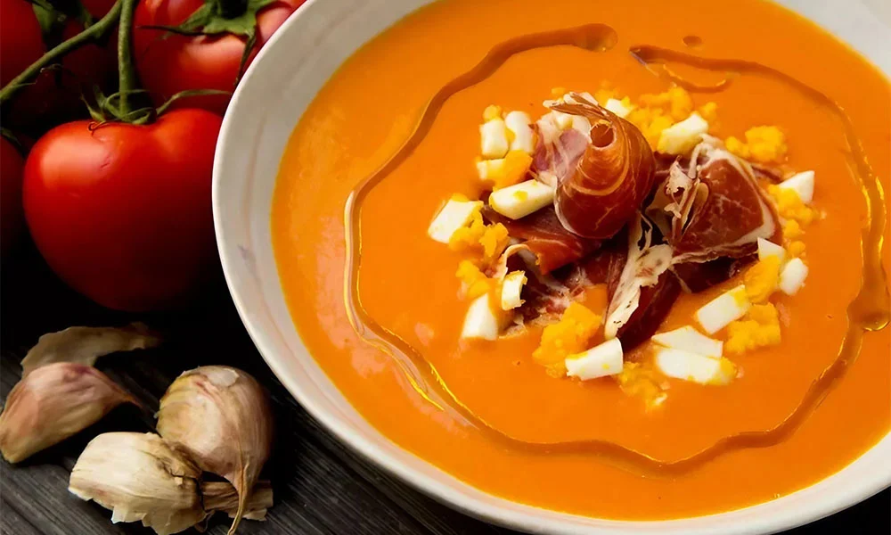 TOMA Spotlight: Andalucian Dishes 1 Salmorejo: Cold tomato soup, Salmorejo, from Cordoba, topped with egg and jamon serrano