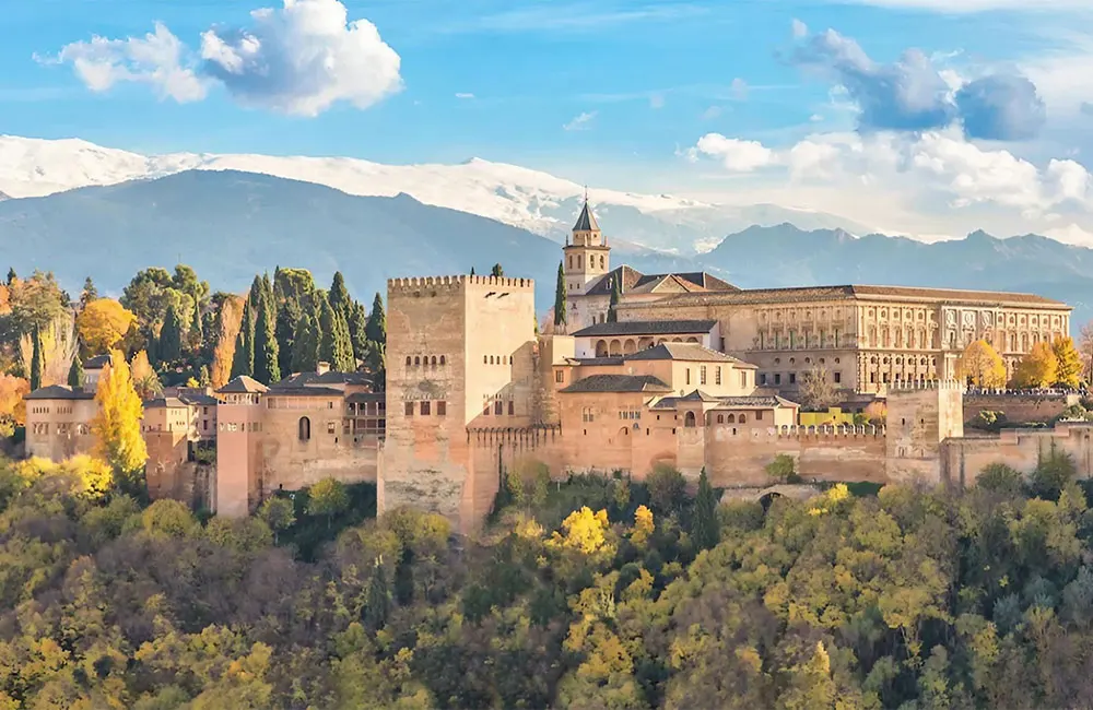 Granada’s Alhambra with snow-capped mountains in the background. Credit: Sergey Dzyuba / Alamy Stock Photo