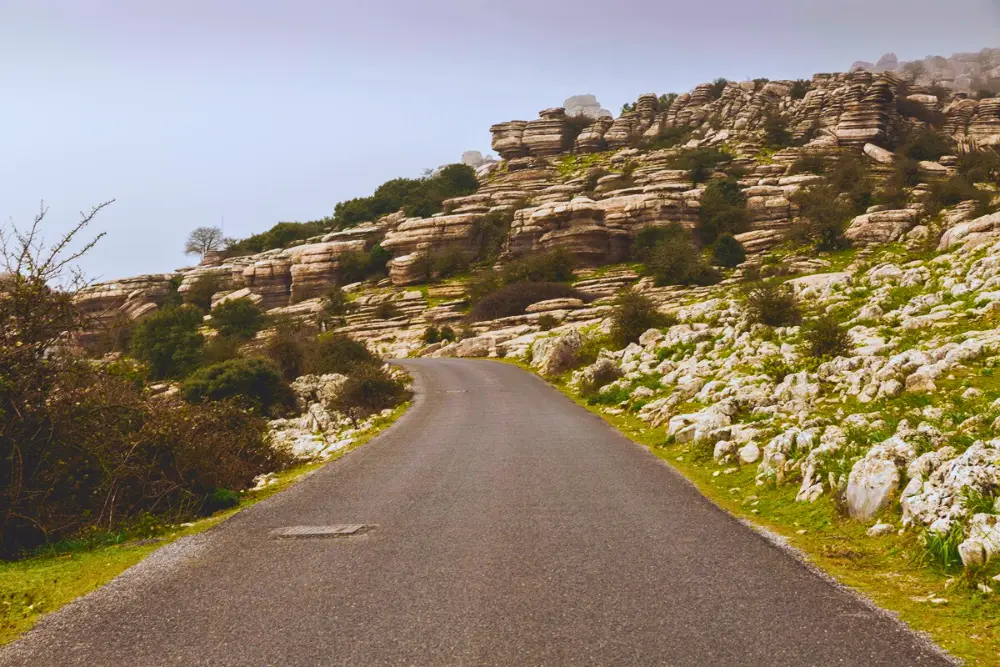 Road through the countryside of Antequera. Photo by G Cicconeto: https://www.pexels.com/photo/serene-roadway-in-antequera-s-rocky-landscape-33688117/