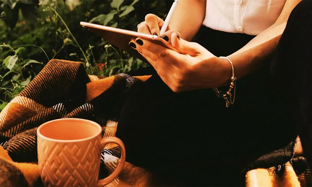 Rejuvenate on Holiday: Make Time to Yourself 1 Woman writing on iPad. Photo by Jonathan Borba: https://www.pexels.com/photo/woman-writing-on-ipad-3082804/